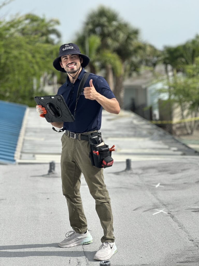 Public adjuster from Elevate Claim Adjusters conducting a roof inspection for property damage assessment in Florida